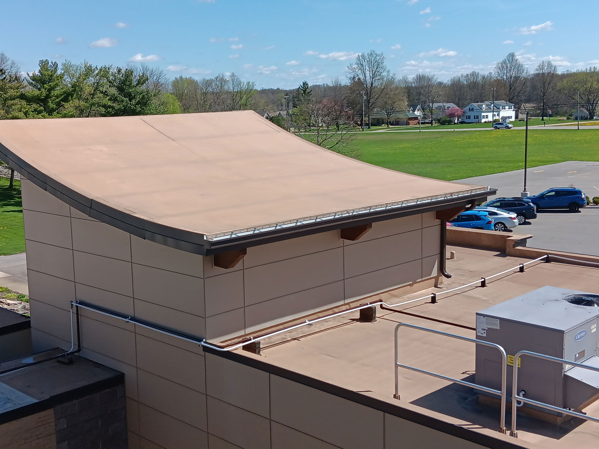 a commercial roofing system on a curved roof