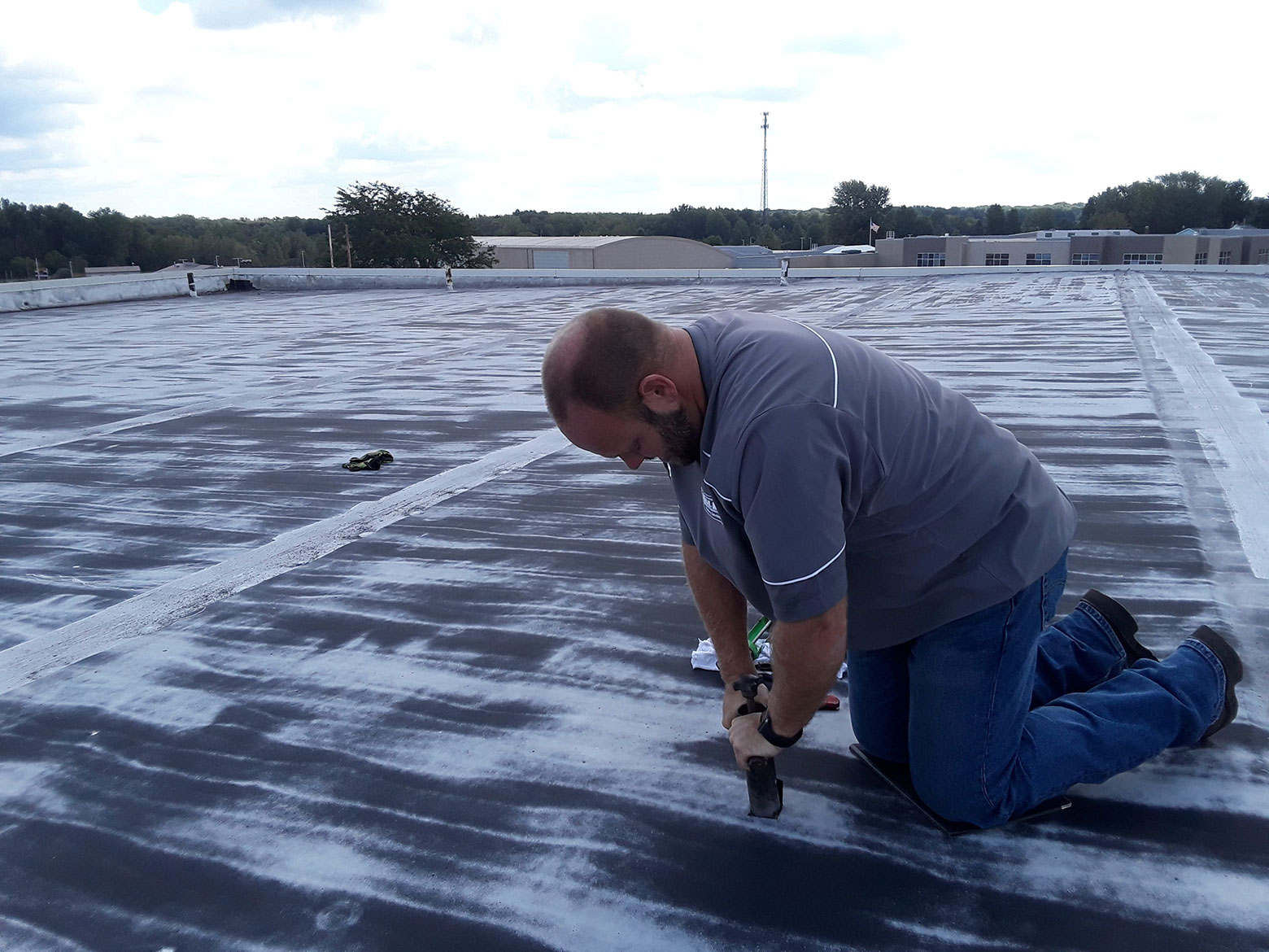 roofer servicing commercial roof